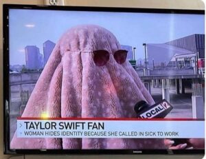 Women with a towel over her head being interviewed